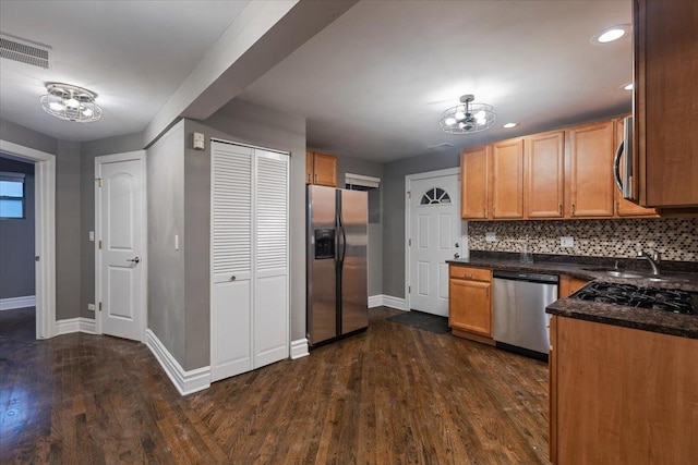 4351 S Forrestville Ave Unit G, Chicago, IL 60653 - kitchen with appliances with stainless steel finishes, dark wood-style flooring, tasteful backsplash, and recessed lighting