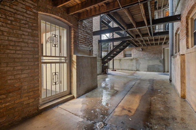 4351 S Forrestville Ave Unit G, Chicago, IL 60653 - misc room featuring brick wall and concrete floors