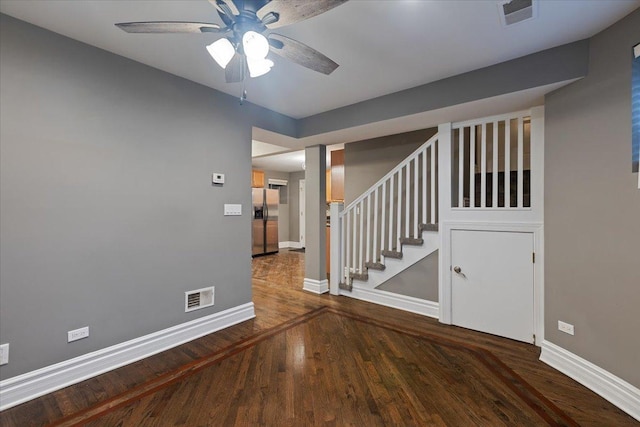 4351 S Forrestville Ave Unit G, Chicago, IL 60653 - empty room with wood finished floors, a ceiling fan, and stairway