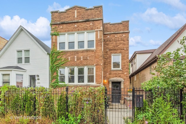 4336 N Troy St, Chicago, IL 60618 - view of front facade featuring brick siding and a gate