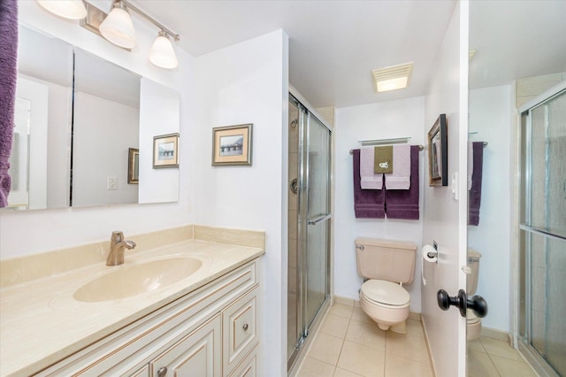 110 W Butterfield Rd Unit 314S, Elmhurst, IL 60126 - full bathroom featuring tile patterned flooring, vanity, and a shower stall