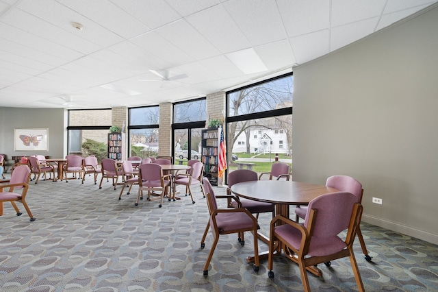 110 W Butterfield Rd Unit 314S, Elmhurst, IL 60126 - dining room with a wall of windows and carpet floors