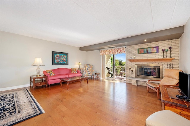 110 W Butterfield Rd Unit 314S, Elmhurst, IL 60126 - living area with wood finished floors and a fireplace