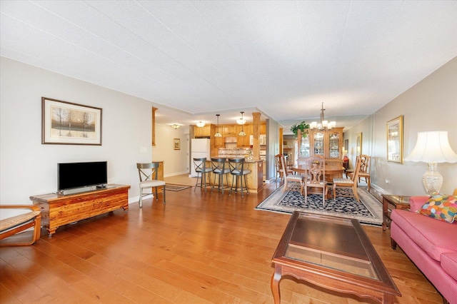 110 W Butterfield Rd Unit 314S, Elmhurst, IL 60126 - living area with a chandelier and wood finished floors