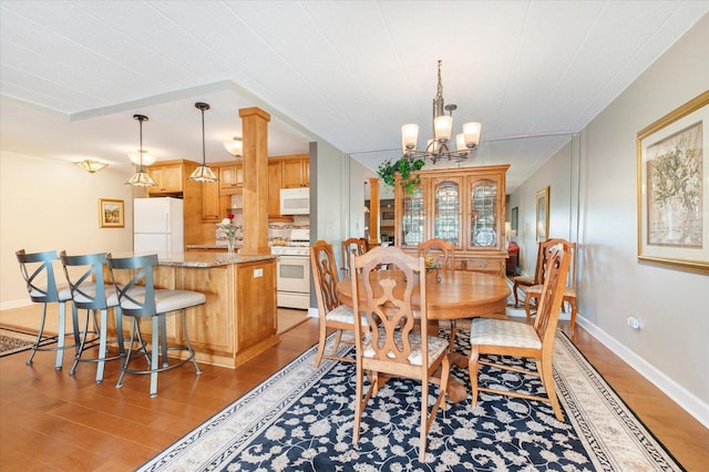 110 W Butterfield Rd Unit 314S, Elmhurst, IL 60126 - dining space featuring light wood finished floors and a chandelier