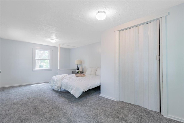 323 N 2nd Ave, Chenoa, IL 61726 - bedroom with carpet floors and a textured ceiling