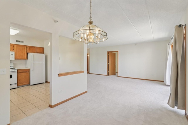 5005 Warren St Unit 403, Skokie, IL 60077 - unfurnished dining area featuring a chandelier, light colored carpet, and light tile patterned floors