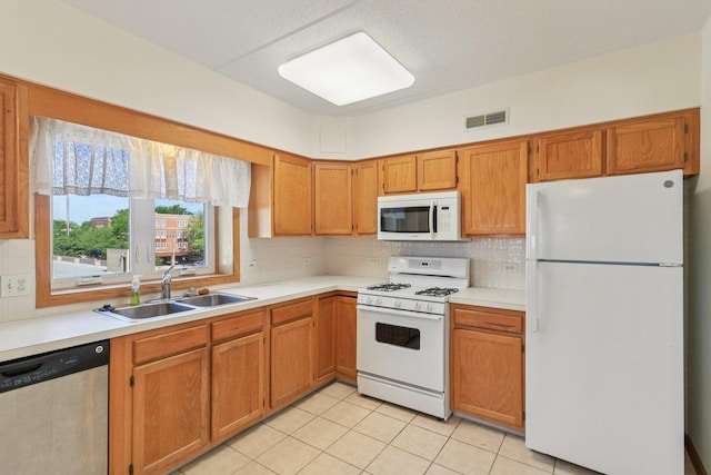 5005 Warren St Unit 403, Skokie, IL 60077 - kitchen with white appliances, light countertops, and decorative backsplash