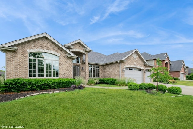 21409 Foxtail Dr, Mokena, IL 60448 - view of front of home with brick siding, a front lawn, and an attached garage