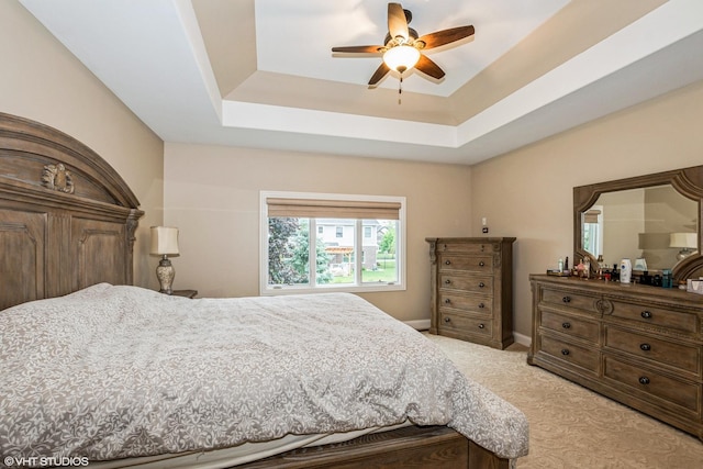 21409 Foxtail Dr, Mokena, IL 60448 - bedroom with light carpet, a raised ceiling, and a ceiling fan