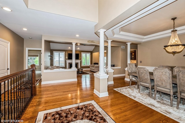 21409 Foxtail Dr, Mokena, IL 60448 - dining space featuring ornate columns, wood finished floors, ornamental molding, and recessed lighting