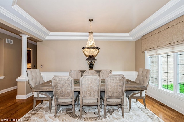 21409 Foxtail Dr, Mokena, IL 60448 - dining space with wood finished floors, ornamental molding, a chandelier, decorative columns, and a raised ceiling