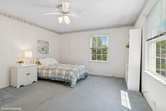 1329 Sanford Ln, Glenview, IL 60025 - bedroom with multiple windows, light carpet, and ceiling fan