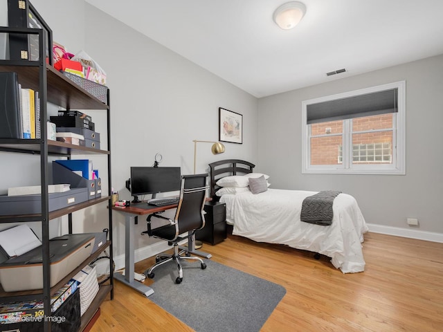 669 N Peoria St Unit 1N, Chicago, IL 60642 - bedroom featuring wood finished floors and a desk