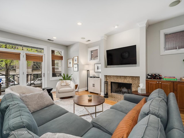 669 N Peoria St Unit 1N, Chicago, IL 60642 - living room featuring light wood-style flooring, a high end fireplace, and recessed lighting