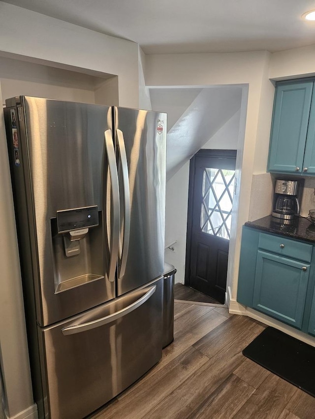 3401 S 56th Ct, Cicero, IL 60804 - kitchen featuring stainless steel fridge with ice dispenser, blue cabinetry, dark countertops, and dark wood-style floors