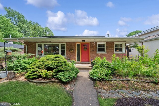 2417 Lyons St, Evanston, IL 60201 - ranch-style house with brick siding and covered porch