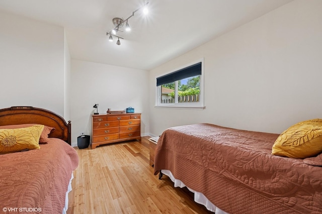 2417 Lyons St, Evanston, IL 60201 - bedroom with light wood-style floors and rail lighting
