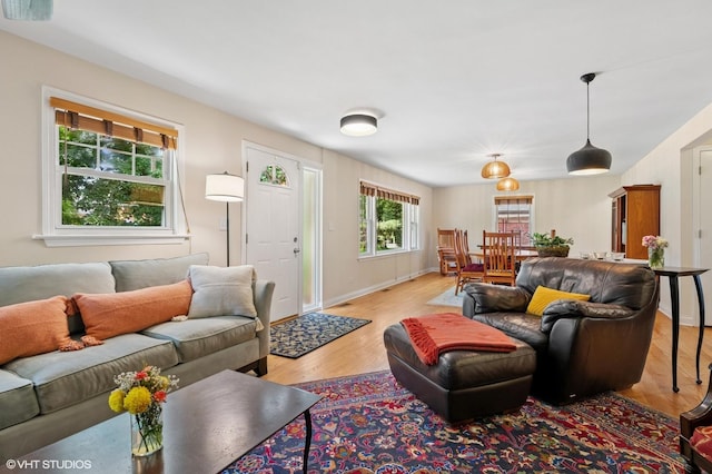 2417 Lyons St, Evanston, IL 60201 - living room with light wood-style floors and baseboards