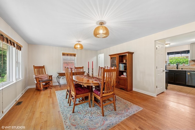 2417 Lyons St, Evanston, IL 60201 - dining area featuring light wood-type flooring and baseboards