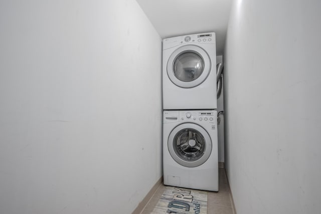1349 W Huron St Unit 1, Chicago, IL 60642 - laundry room featuring stacked washer and clothes dryer and light tile patterned floors