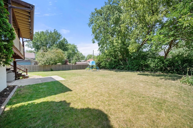 819 Stowell Ave, Streamwood, IL 60107 - fenced backyard with a playground and a patio