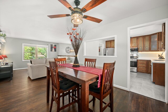 819 Stowell Ave, Streamwood, IL 60107 - dining room featuring a ceiling fan and dark wood-type flooring