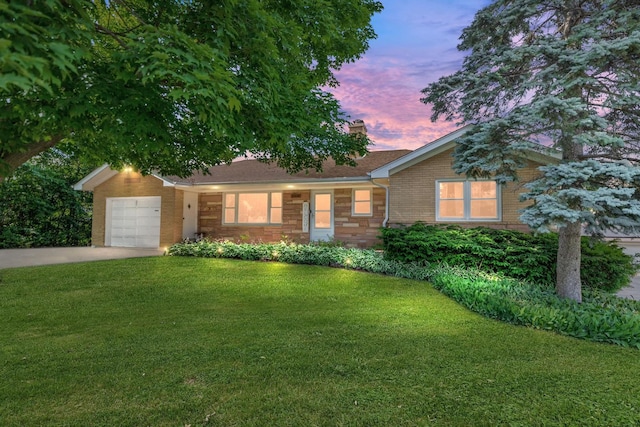 11608 Maple Ave, Hebron, IL 60034 - ranch-style house with brick siding, a garage, a front lawn, concrete driveway, and a chimney