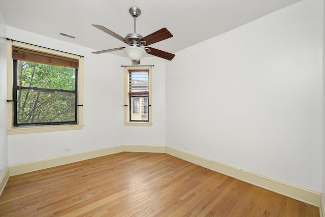7633 N Greenview Ave Unit 3W, Chicago, IL 60626 - empty room with plenty of natural light, light wood-type flooring, and ceiling fan
