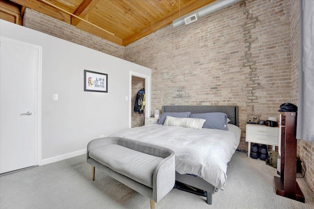 1801 S Michigan Ave Unit 701, Chicago, IL 60616 - carpeted bedroom with a wood ceiling with exposed beams, brick wall, a towering ceiling, and a walk in closet