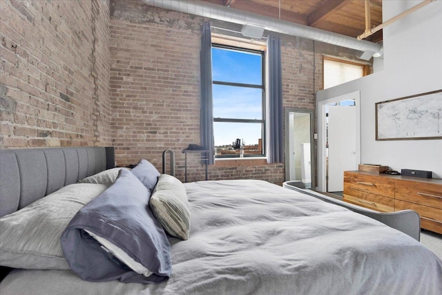 1801 S Michigan Ave Unit 701, Chicago, IL 60616 - bedroom with brick wall, a towering ceiling, and a wooden ceiling with exposed beams