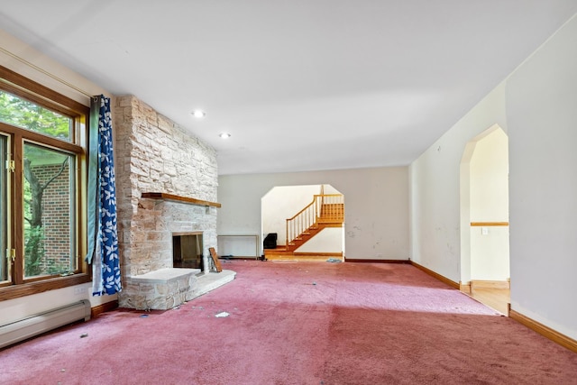 1313 Plum Tree Rd, Barrington Hills, IL 60010 - unfurnished living room with a baseboard radiator, arched walkways, carpet, a fireplace, and stairway