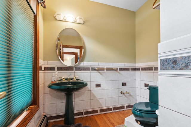 1313 Plum Tree Rd, Barrington Hills, IL 60010 - bathroom with tile walls, wainscoting, wood finished floors, and a baseboard radiator