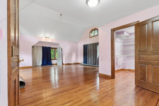 1313 Plum Tree Rd, Barrington Hills, IL 60010 - unfurnished living room featuring vaulted ceiling and light wood finished floors
