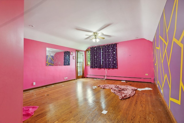 1313 Plum Tree Rd, Barrington Hills, IL 60010 - empty room featuring a baseboard radiator, a ceiling fan, wood finished floors, and lofted ceiling