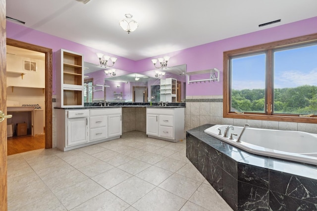 1313 Plum Tree Rd, Barrington Hills, IL 60010 - full bath featuring vanity, a chandelier, a bath, and tile patterned flooring