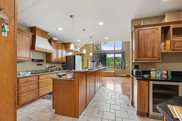 1313 Plum Tree Rd, Barrington Hills, IL 60010 - kitchen featuring beverage cooler, freestanding refrigerator, an island with sink, custom exhaust hood, and dark stone counters