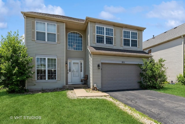 1811 Prairie Ridge Dr, Plainfield, IL 60586 - view of front facade with an attached garage, driveway, and a front yard