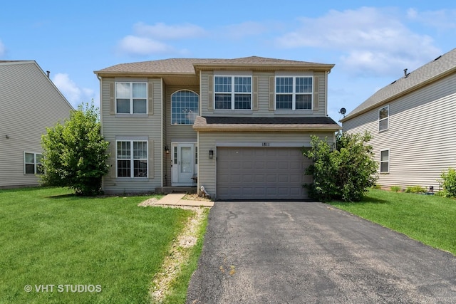 1811 Prairie Ridge Dr, Plainfield, IL 60586 - view of front of house with asphalt driveway, a garage, and a front yard