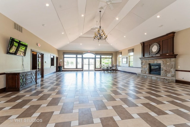 1811 Prairie Ridge Dr, Plainfield, IL 60586 - unfurnished living room with high vaulted ceiling, a stone fireplace, recessed lighting, beam ceiling, and a chandelier