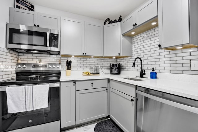 10 E Ontario St Unit 907, Chicago, IL 60611 - kitchen with stainless steel appliances, tasteful backsplash, and light stone countertops