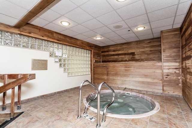 10 E Ontario St Unit 907, Chicago, IL 60611 - bar with a jacuzzi, wooden walls, and recessed lighting