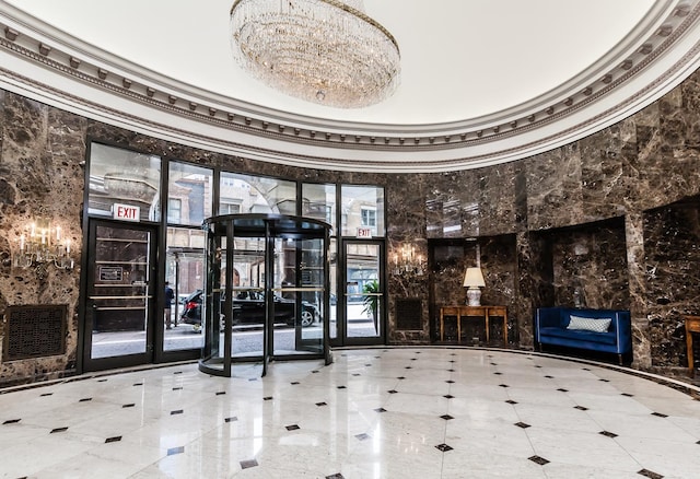 10 E Ontario St Unit 907, Chicago, IL 60611 - community lobby with crown molding and a towering ceiling