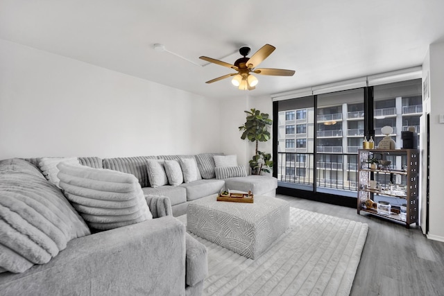 10 E Ontario St Unit 907, Chicago, IL 60611 - living room with floor to ceiling windows, wood finished floors, and ceiling fan