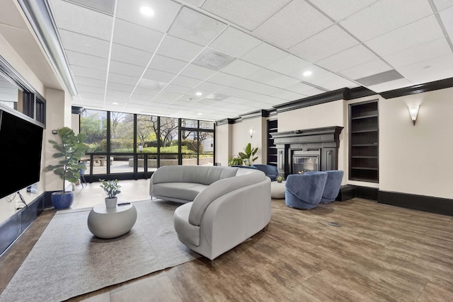 10 E Ontario St Unit 907, Chicago, IL 60611 - living room with a wall of windows, a glass covered fireplace, and a drop ceiling
