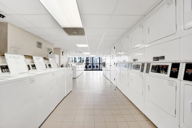 10 E Ontario St Unit 907, Chicago, IL 60611 - communal laundry room featuring stacked washer / dryer, washer and dryer, and light tile patterned floors