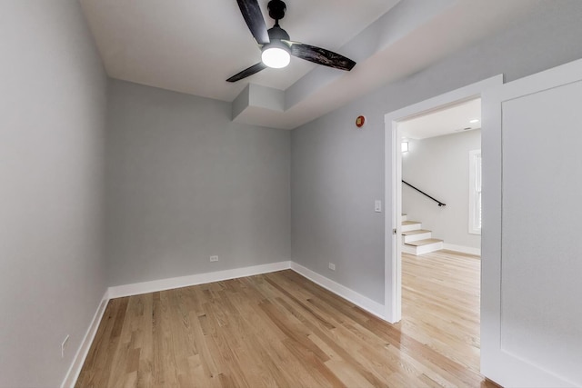 5735 S Fairfield Ave, Chicago, IL 60629 - spare room with light wood finished floors, stairs, and a ceiling fan