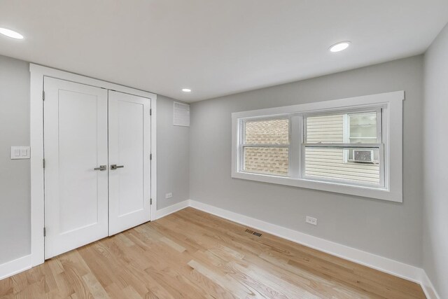 5735 S Fairfield Ave, Chicago, IL 60629 - unfurnished bedroom featuring light wood-style floors, a closet, and recessed lighting