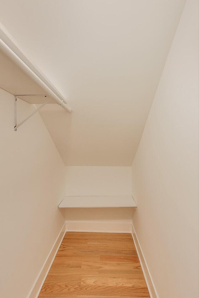 5735 S Fairfield Ave, Chicago, IL 60629 - walk in closet with light wood-type flooring