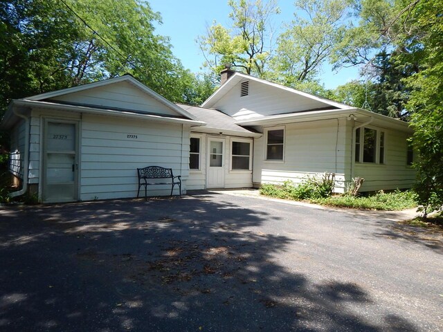27375 W Nippersink Rd, Ingleside, IL 60041 - view of front of home with a chimney and driveway
